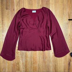 Burgundy satin long sleeve blouse with bell sleeves and V-neck